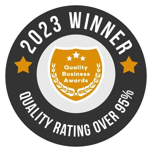 Circular badge with black, white, and gold colors, displaying '2023 WINNER' and 'QUALITY RATING OVER 95%' with stars and a shield.