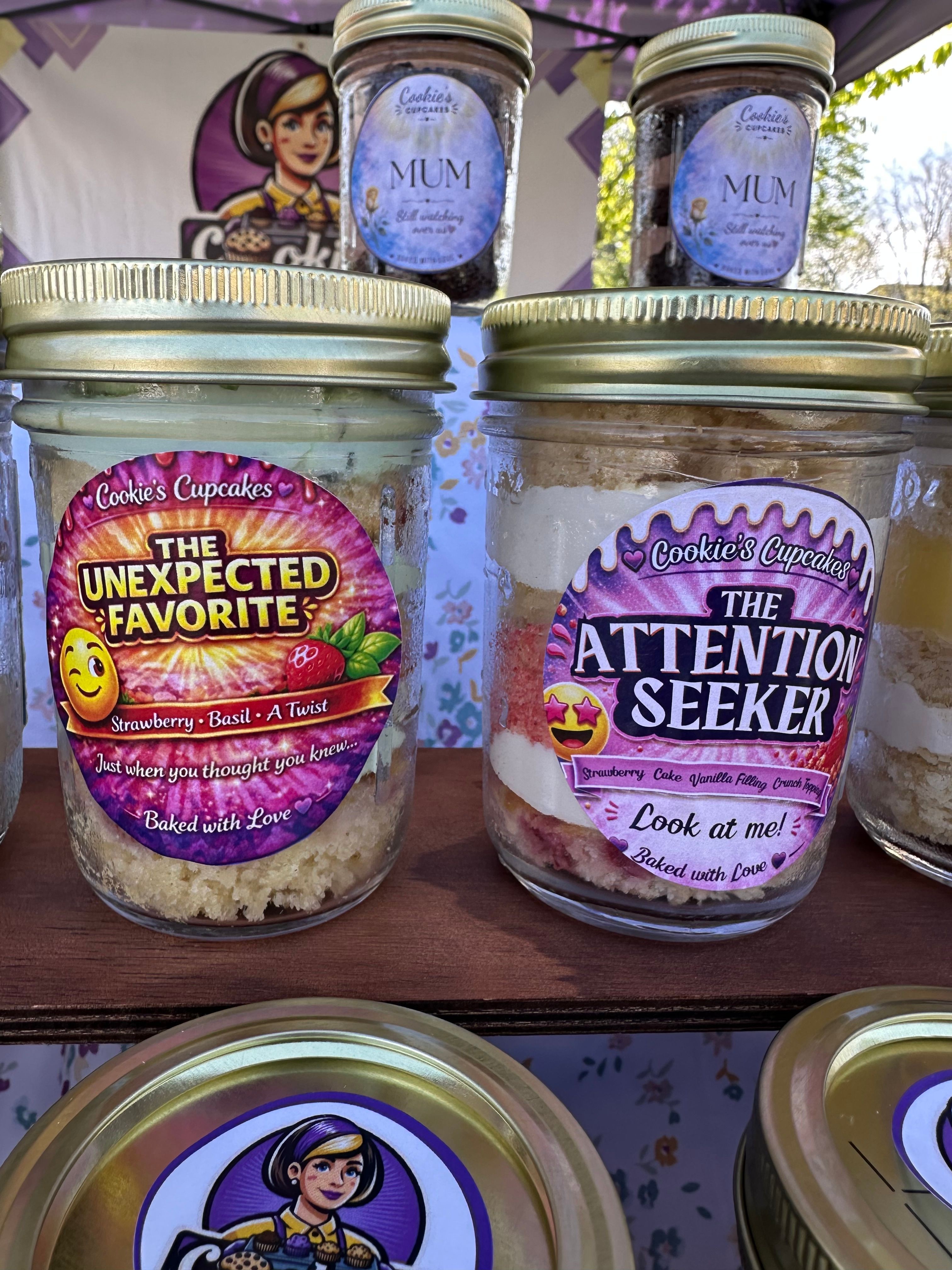 Canned food with colorful labels, jars with blue labels, and containers with cartoon character labels on a wooden surface.