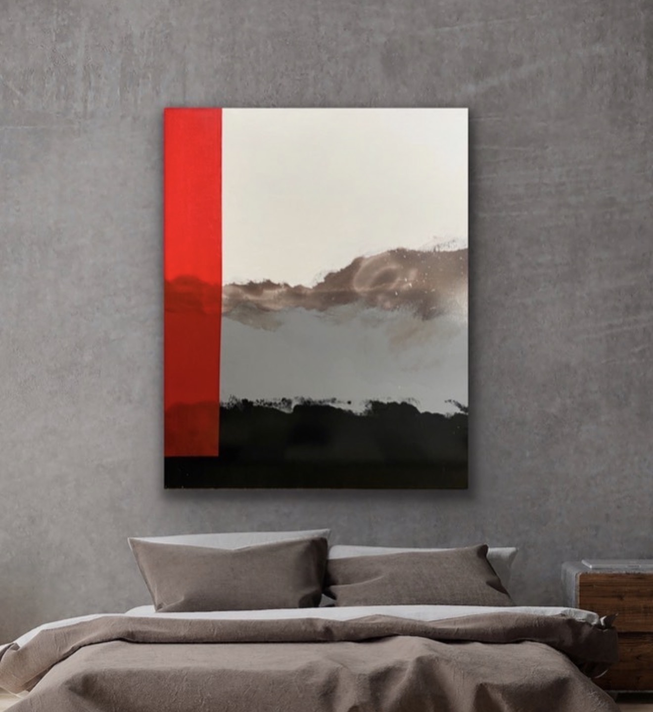 Abstract painting with a red stripe on the left, cloudy sky, and dark landscape, hanging above a bed with gray pillows.