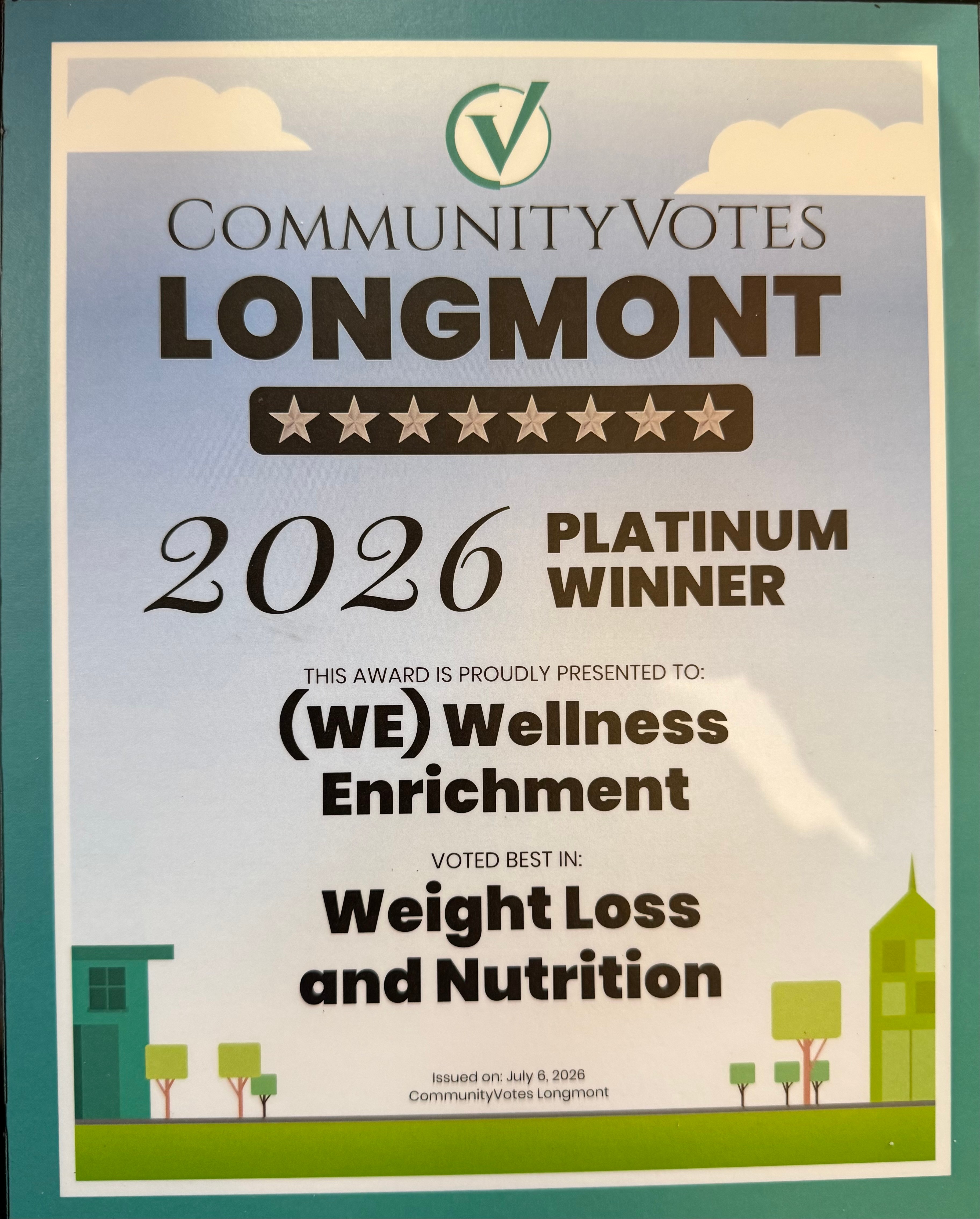 Community votes Longmont 2026 platinum winner award for wellness enrichment, weight loss, and nutrition, with trees and buildings at bottom.