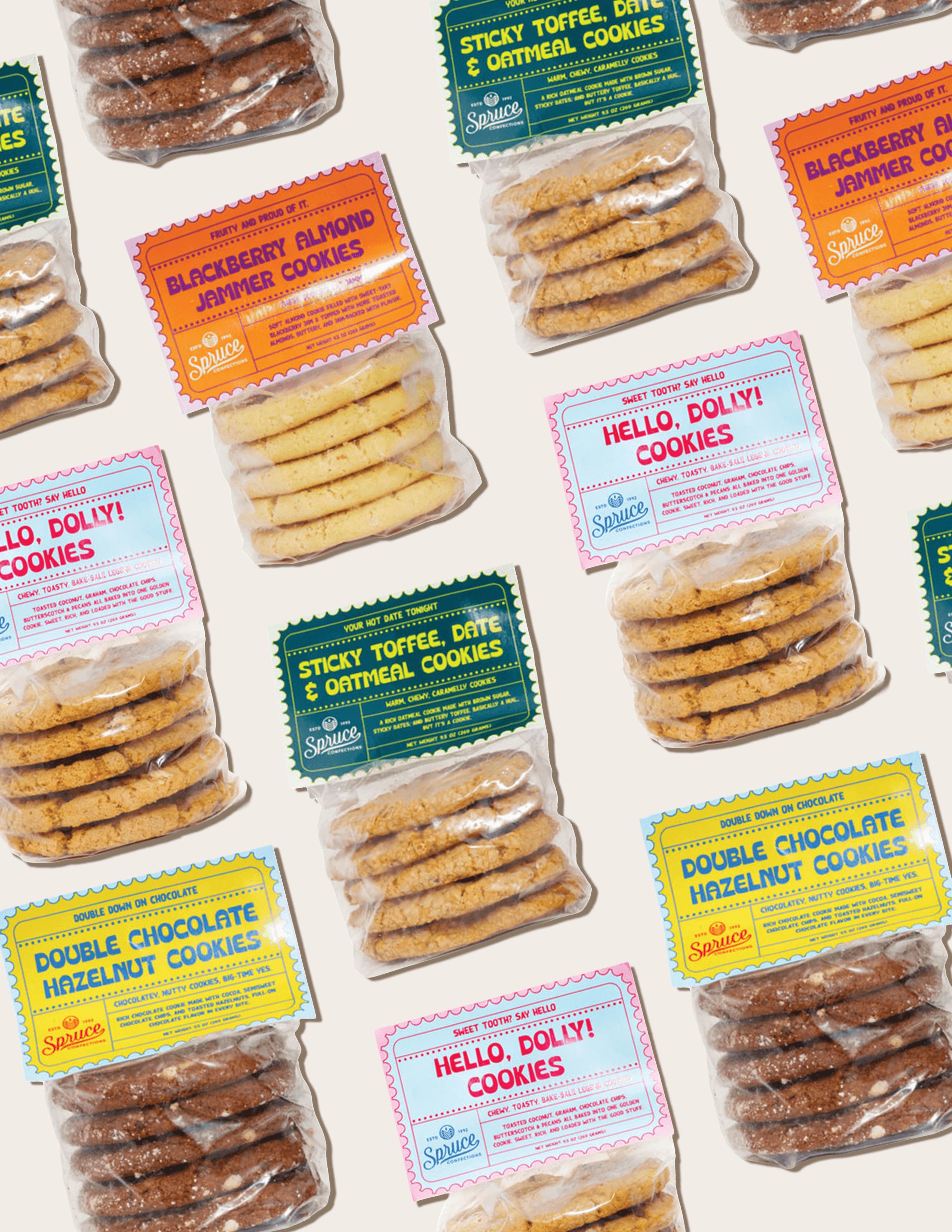 Assorted cookies in colorful packaging arranged diagonally, with labels including Hello Dolly, Double Chocolate, and Sticky Toffee.