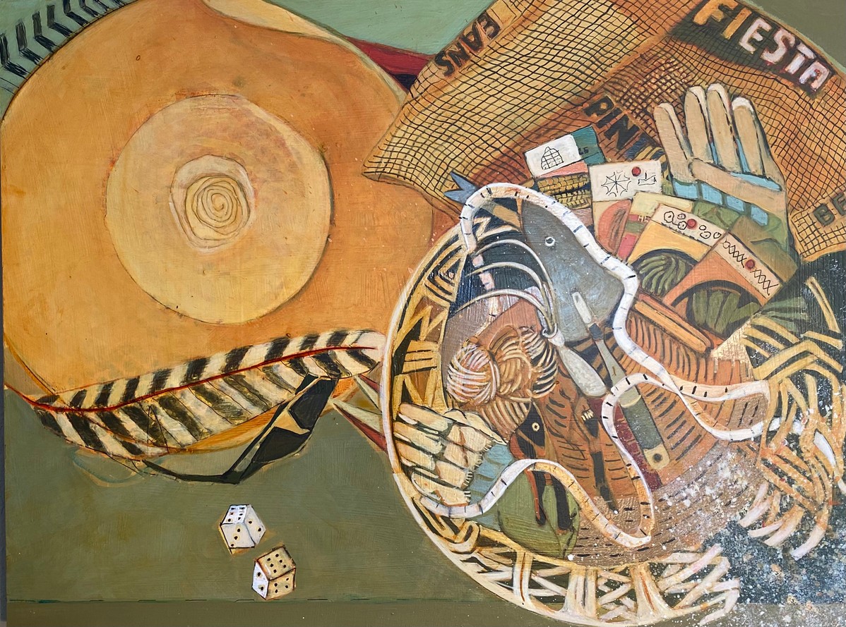 A large round loaf of bread, a woven basket with various items, and two dice on a green surface.