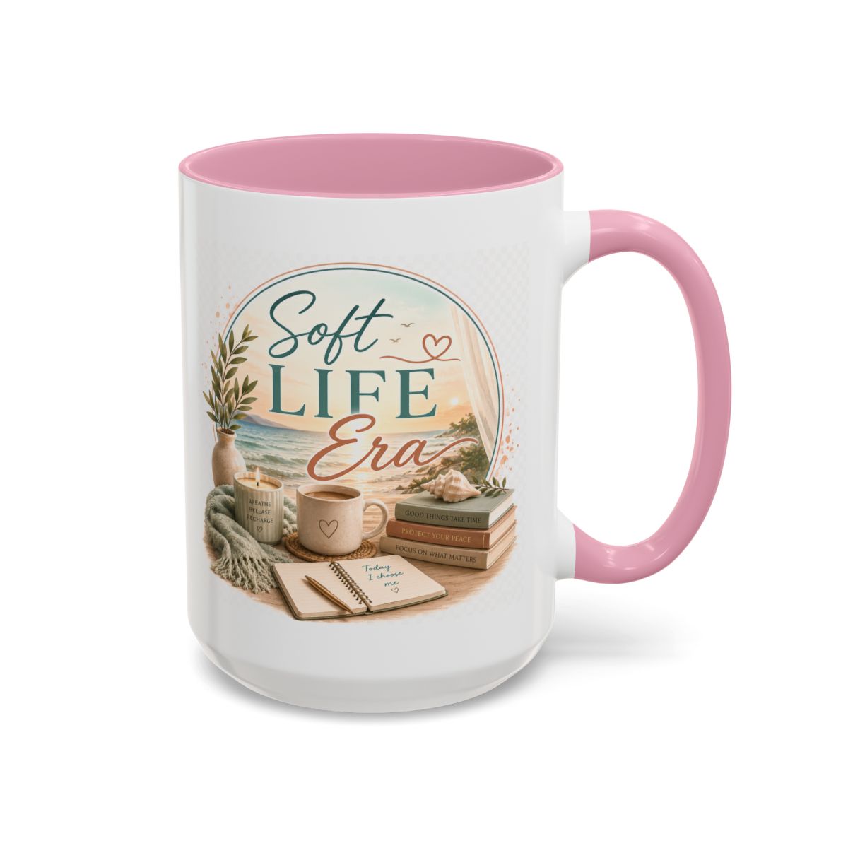 White mug with pink handle and interior, featuring a design with books, a cup, and decorative elements, and the text 