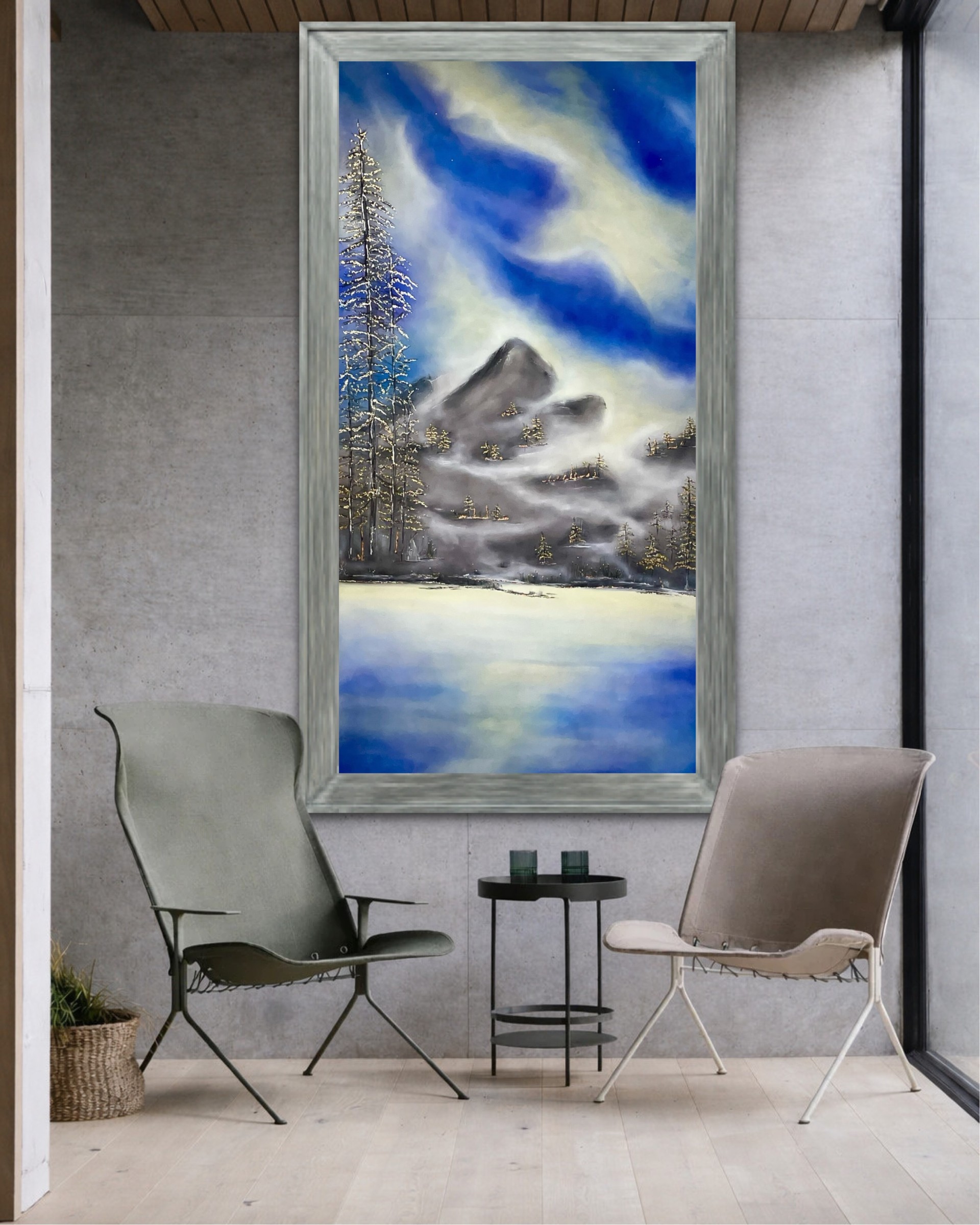 Interior with two chairs, a small table, and a large window showing a landscape painting of a cloudy sky, trees, and water.
