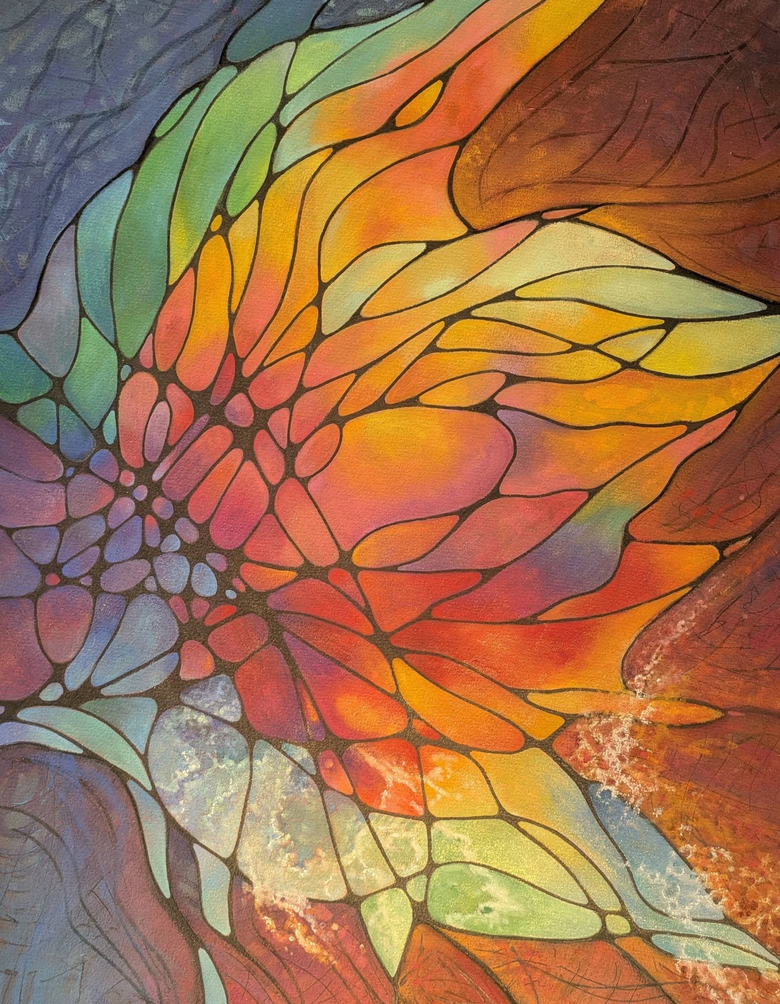 Colorful abstract pattern resembling a butterfly or flower with vibrant orange, yellow, green, and purple hues.