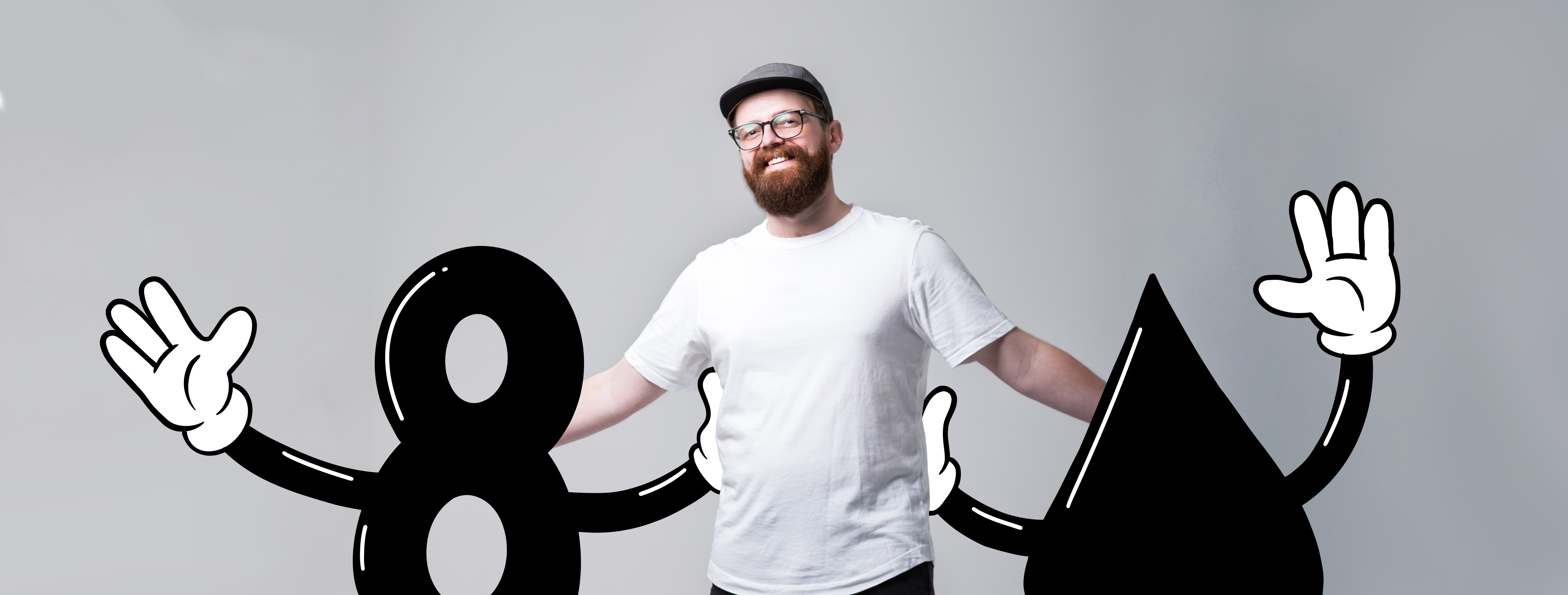 Man with glasses and beard smiling, standing between large black and white cartoon numbers, holding hands with cartoon figures.