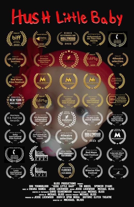 Poster with red text 'Hush Little Baby' and multiple award laurels, some with text, on a black background.