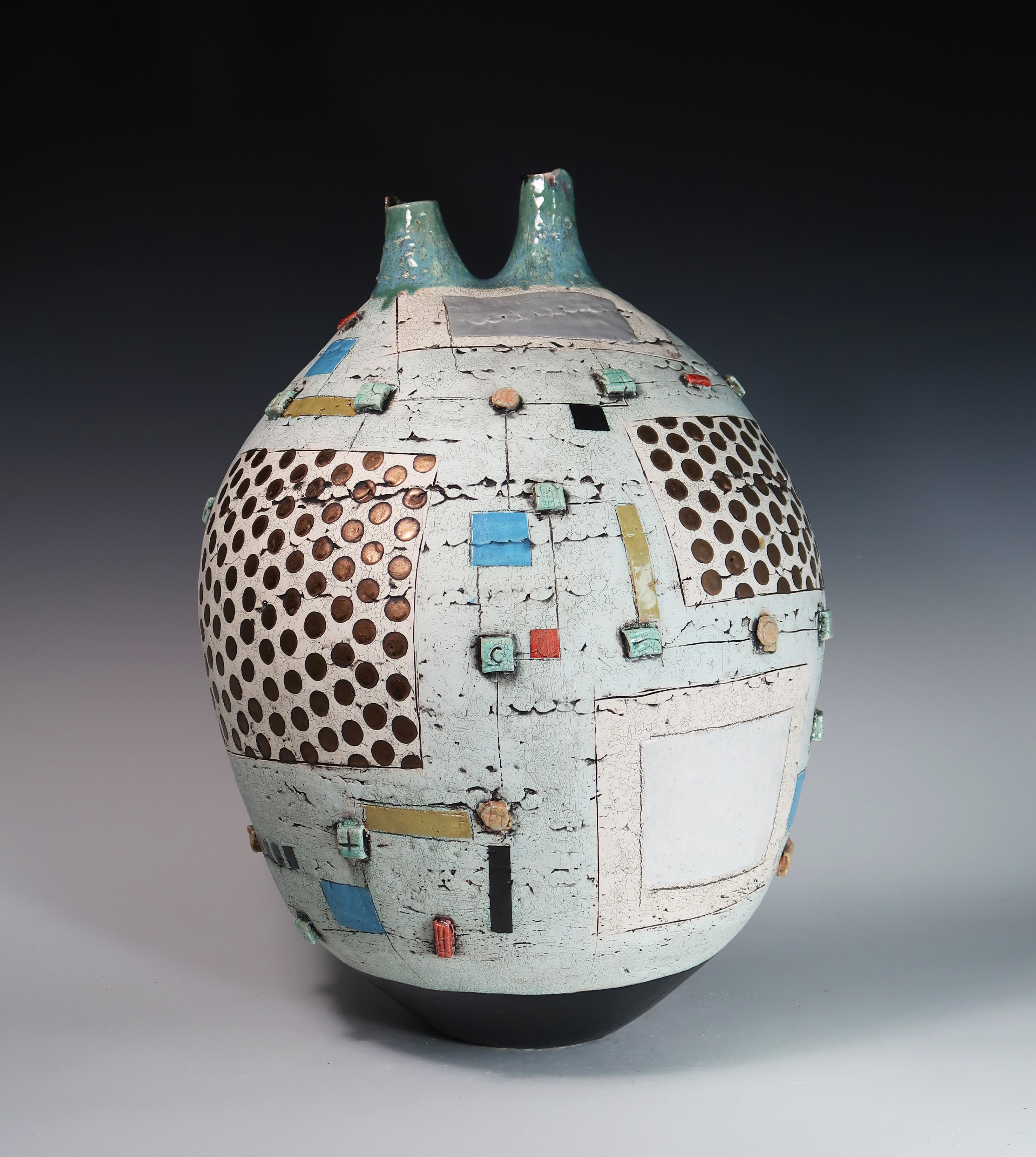 Decorative ceramic vase with geometric patterns and small colorful accents, rounded shape, two small handles at top, on a gradient background.