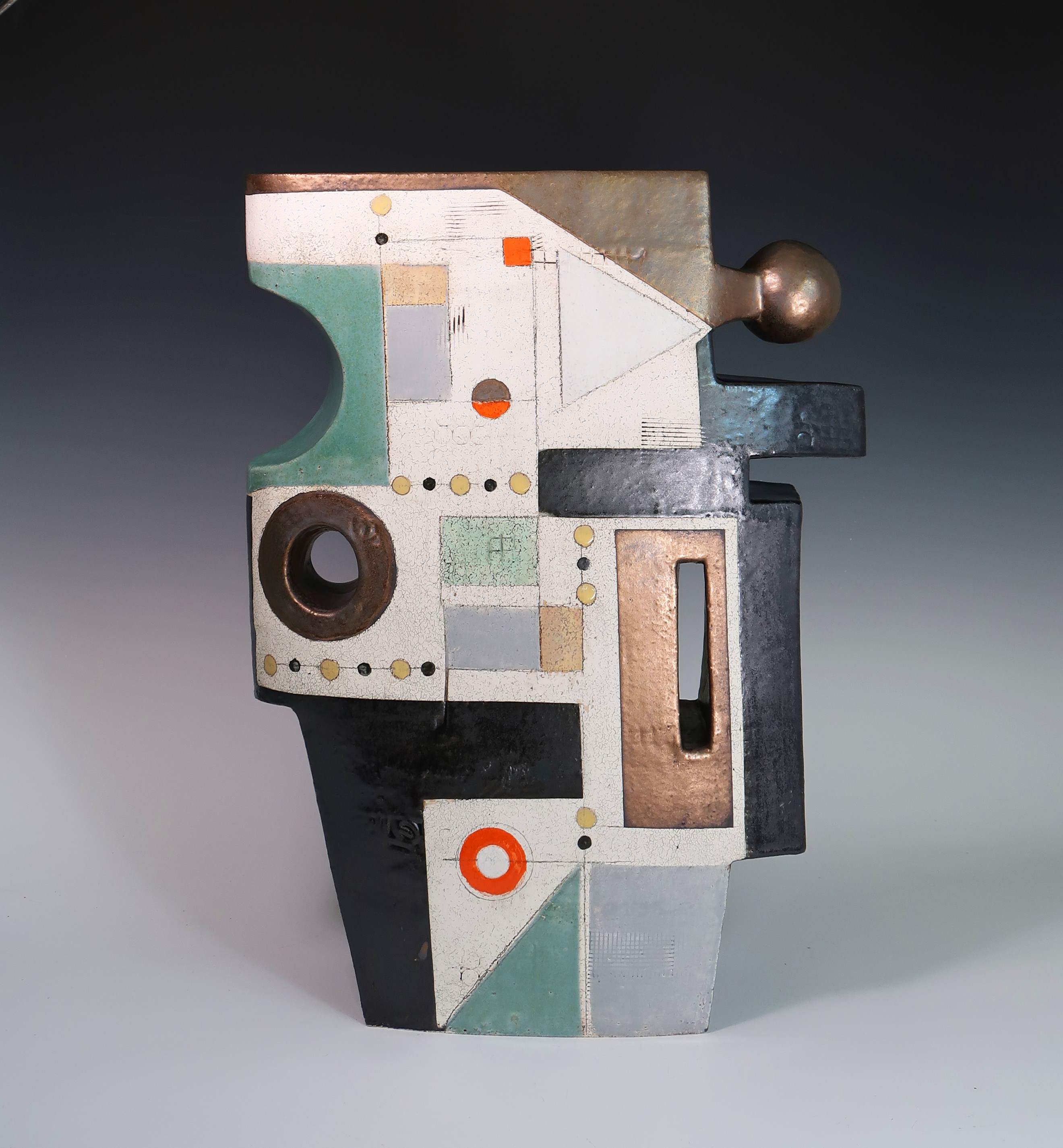 Abstract geometric sculpture with various shapes and colors, including black, white, green, and copper, on a gradient background.