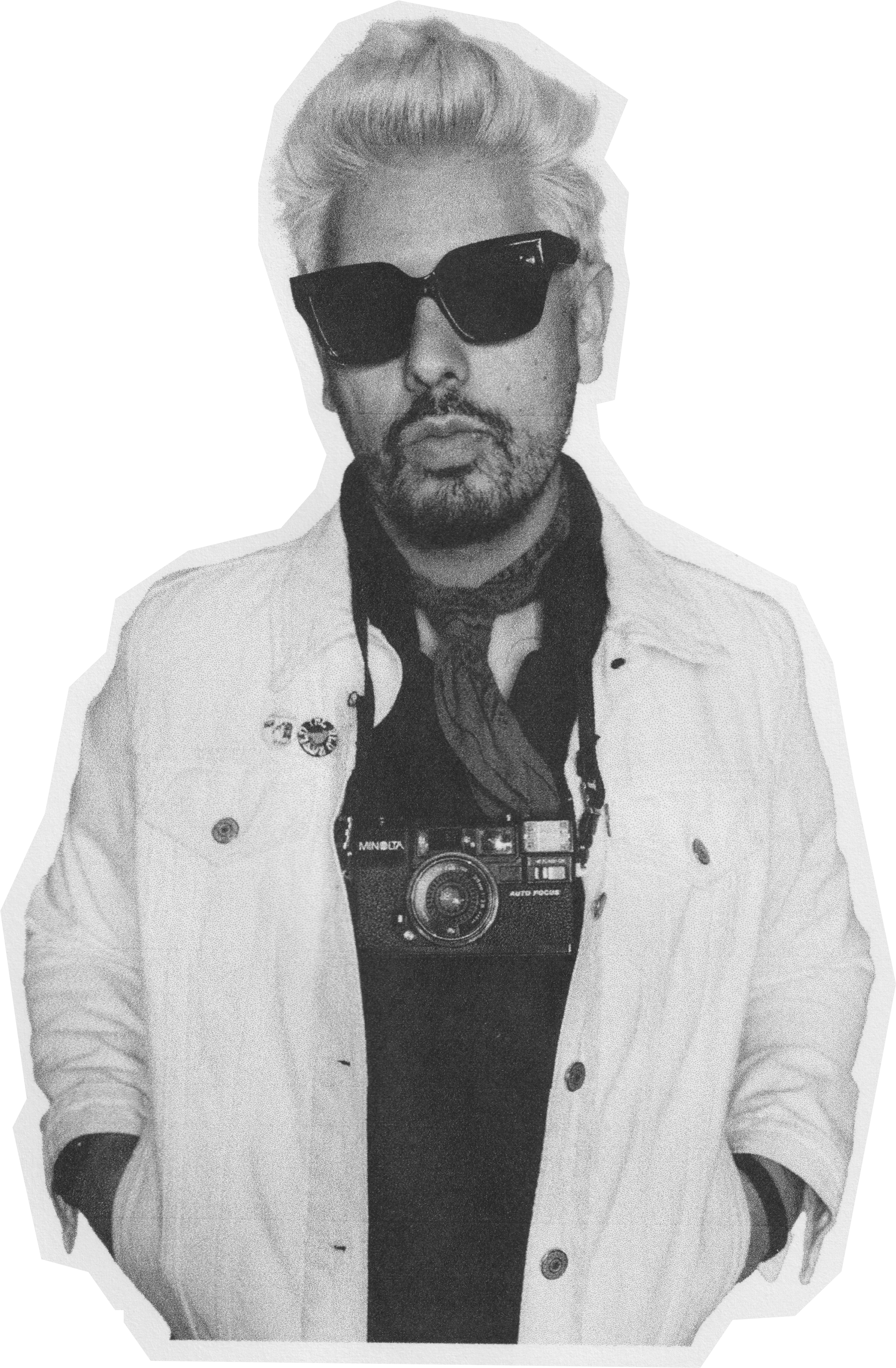 Man with sunglasses, beard, and mustache wearing a white jacket and camera around neck, against black background.