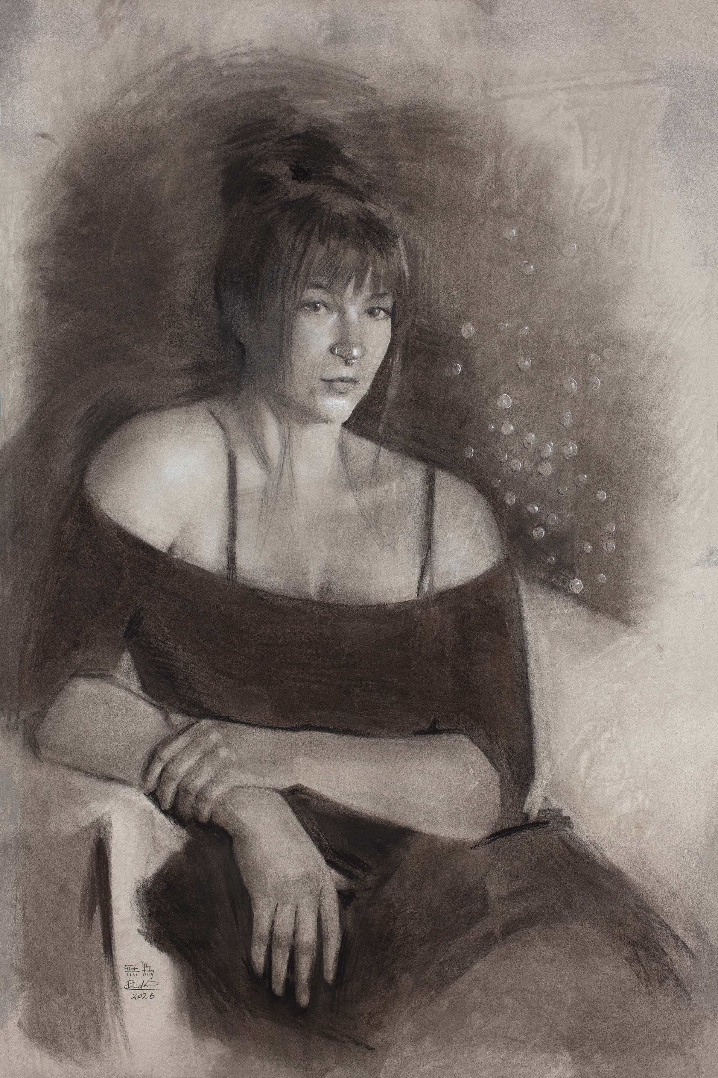 Portrait of a woman with short hair, wearing an off-shoulder top, sitting with hands resting on her lap, in grayscale.