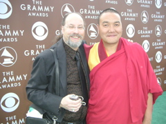 Two men standing together at an event with a backdrop displaying 'The Grammy Awards' and CBS logos.