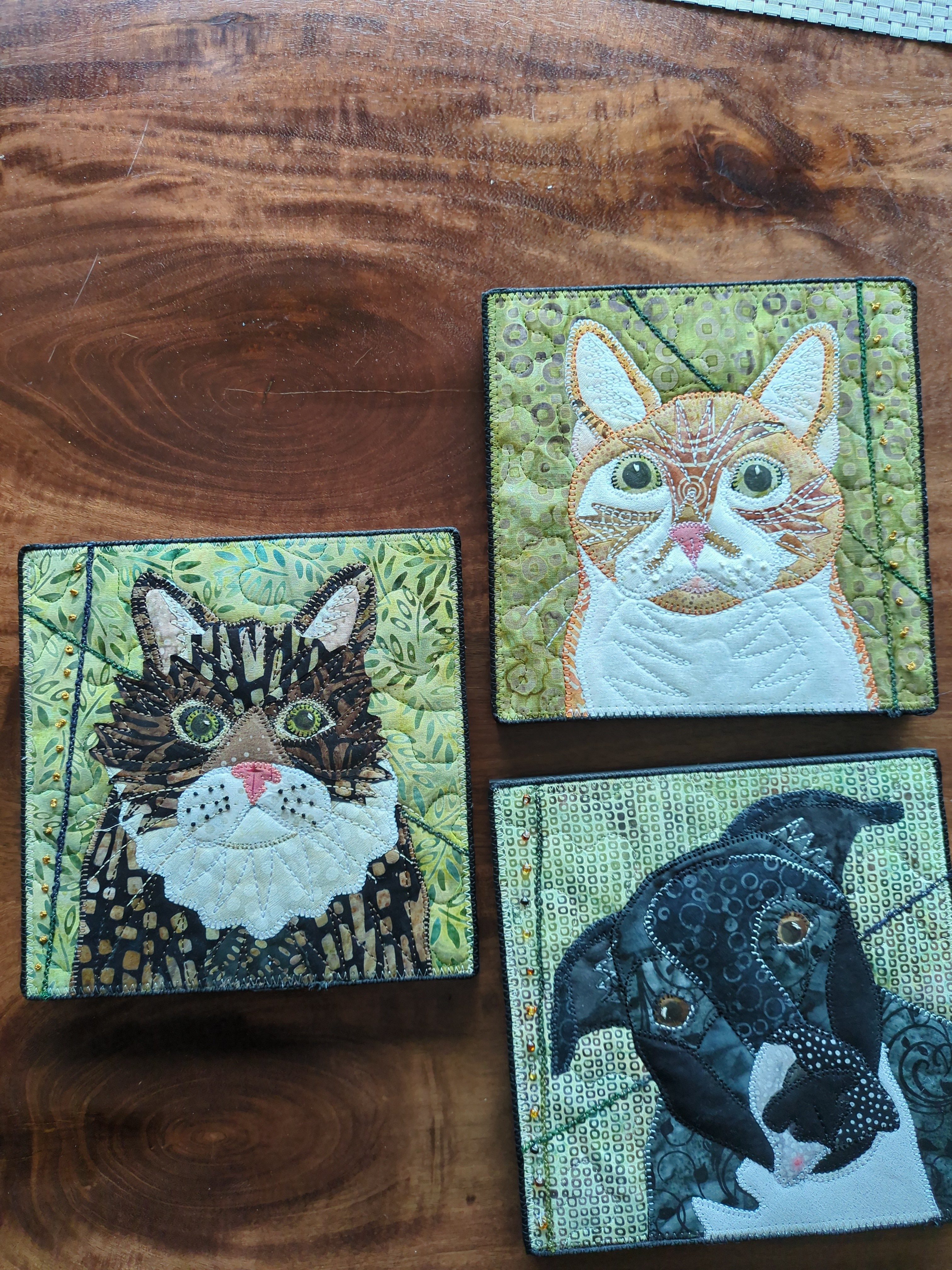 Three jigsaw puzzle pieces with animal illustrations on a wooden surface.