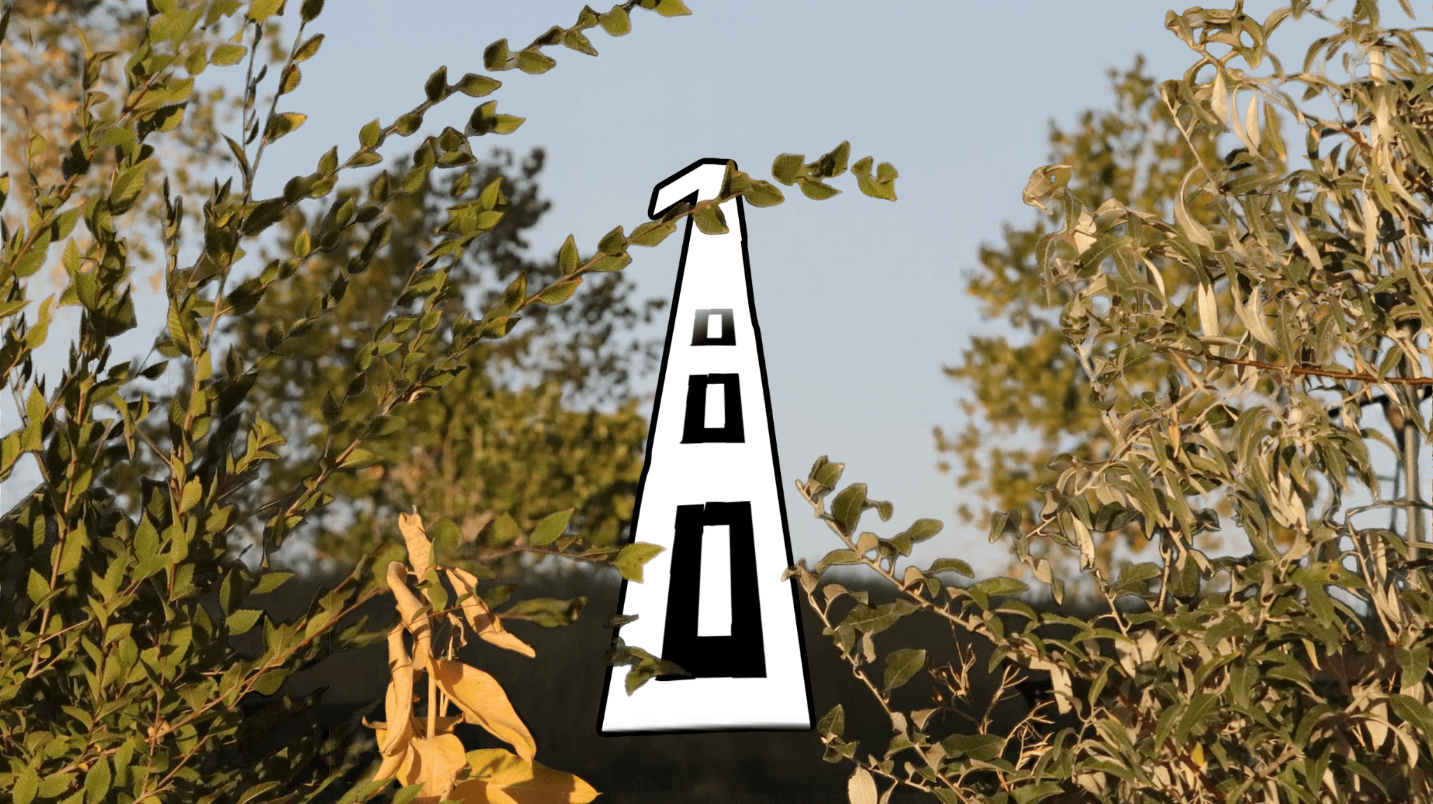 Tall, narrow sign with the number 100 on it, surrounded by trees and foliage, against a clear sky.